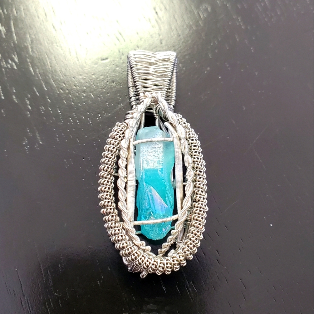The ice dragons fang / intricate wire wrapped pendant with quartz crystal